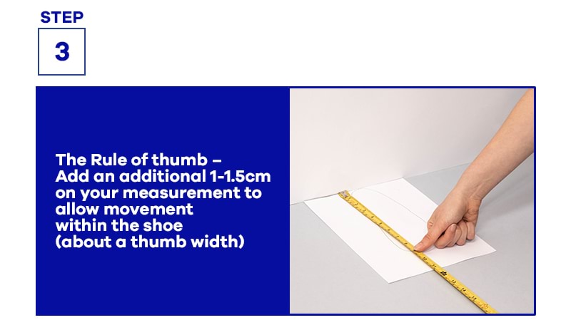 hand holding measuring tape on A4 paper with instructions on measuring feet